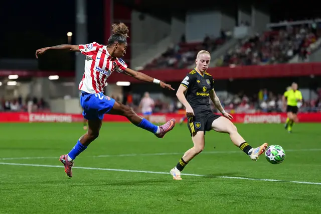 Jenna Nighswonger of Arsenal shoots whilst under pressure from Anna Sandberg of Manchester United during the UEFA Women's Champions League 2025/26 league phase match between Club Atletico de Madrid and Manchester United Women