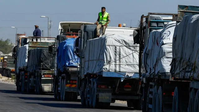 A line of aid trucks