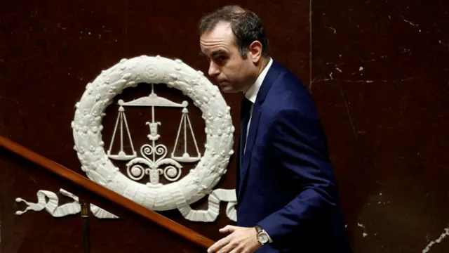 French Prime Minister Sébastien Lecornu in parliament, wearing a navy suit