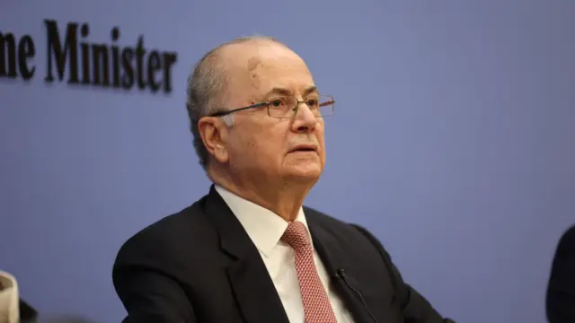 Mohammed Mustafa sat at press conference