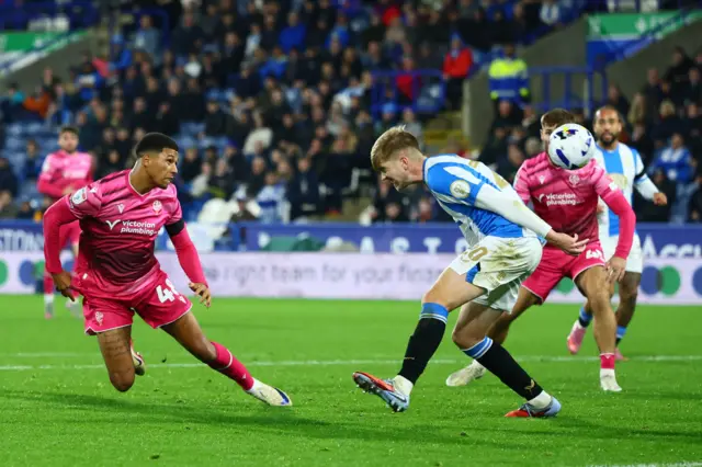 Mason Burstow of Bolton Wanderers heads at goal