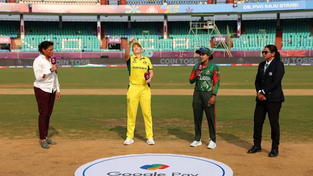 Alyssa Healy of Australia tosses the coin alongside Nigar Sultana Joty of Bangladesh
