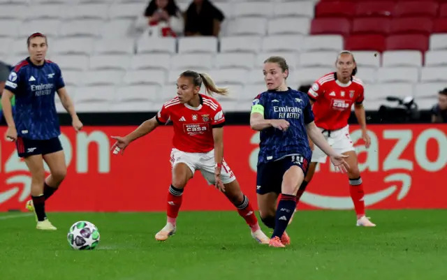 Benfica's Lucia Alves in action with Arsenal's Kim Little