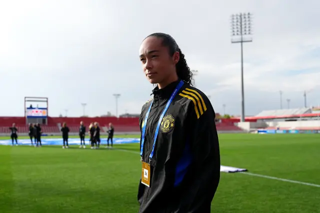 Phallon Tullis-Joyce of Manchester United looks on.