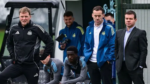 Head coach Eddie Howe and sporting director Ross Wilson watch the Newcastle United training session