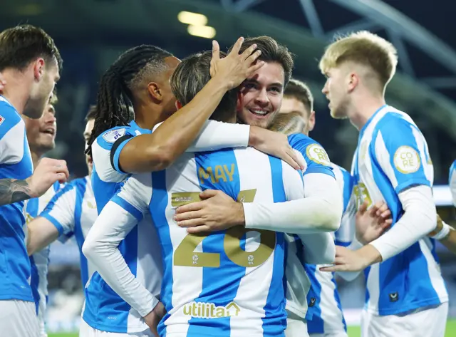 Leo Castledine of Huddersfield Town celebrates scoring the opening goal with team-mates