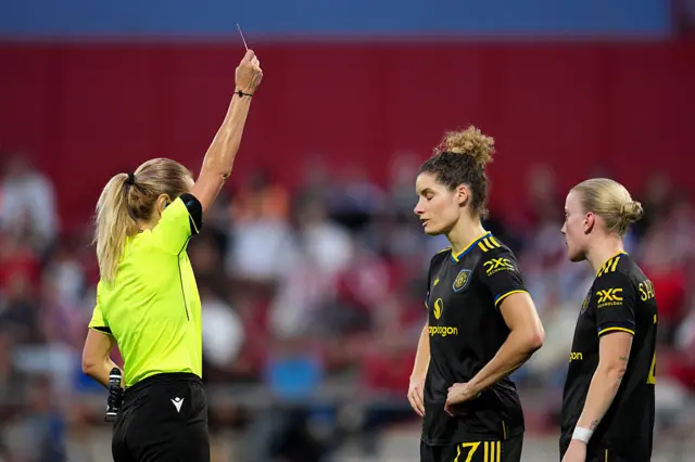 Eleni Antoniou shows a red card to Dominique Janssen