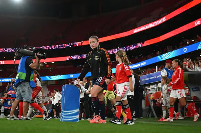 Kim Little of Arsenal leads the team out