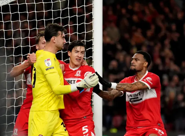 Middlesbrough goalkeeper Sol Brynn celebrates saving a penalty with his teammates