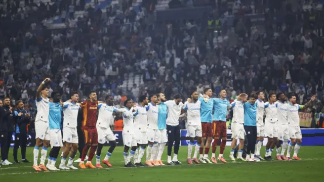Players of Olympic de Marseille celebrate with their supporters after winning the UEFA Champions League league phase soccer match between Olympique Marseille and Ajax Amsterdam in Marseille
