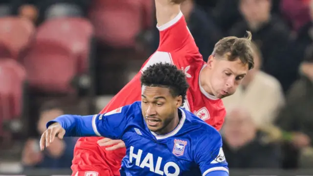 Callum Brittain of Middlesbrough fouls Jens Cajuste of Ipswich Town