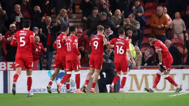 Players of Middlesbrough celebrate their team's first goal, an own goal scored by Cedric Kipre of Ipswich Town