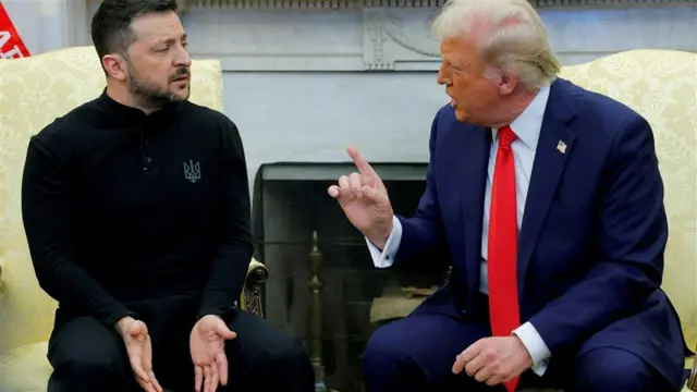 zelensky gestures with his hands on his lap, which trump points a finger towards them. they are in the oval office
