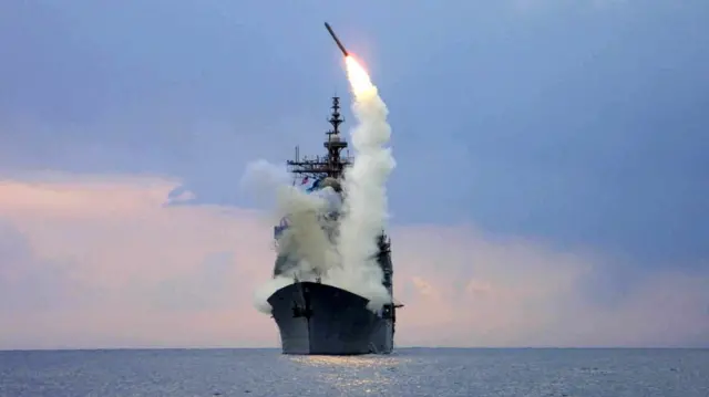 Tomahawk Land Attack Missile (TLAM) is launched from the guided missile cruiser