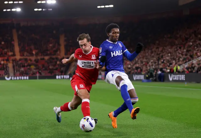 Callum Brittain of Middlesbrough controls the ball under pressure from Jaden Philogene of Ipswich Town