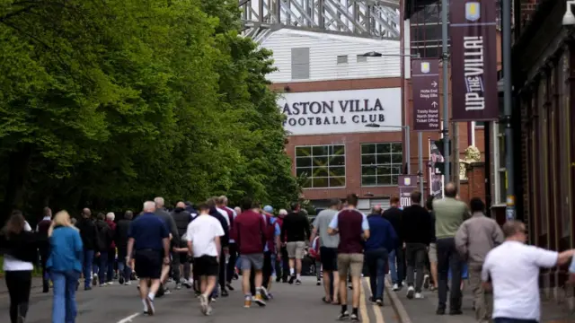 Crowds head towards the Aston Villa home ground in Birmingham.