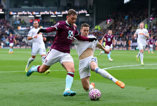Jacob Bruun Larsen of Burnley battles for possession with Gabriel Gudmundsson of Leeds