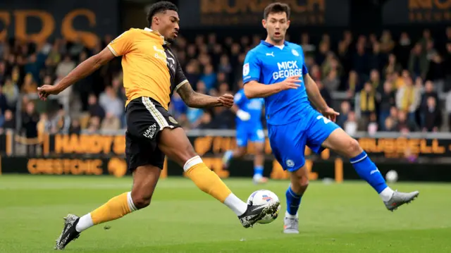 Tyrese Shade of Burton Albion in action against Thomas O'Connor of Peterborough United