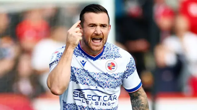 Jack Marriott of Reading points to his temple