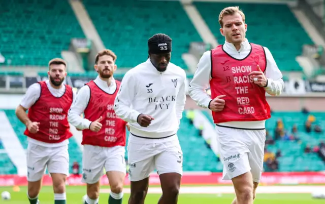 Hibs players warming up at Easter Road
