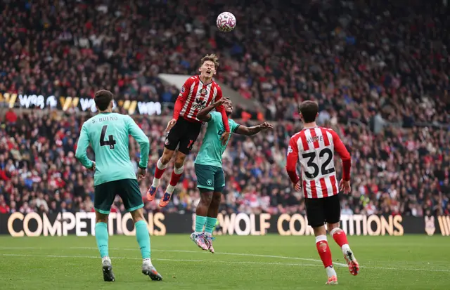 Chris Rigg of Sunderland reacts as he competes for a header against Jhon Arias of Wolverhampton Wanderers
