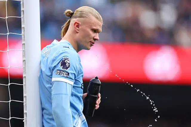 Erling Haaland of Manchester City spits out water