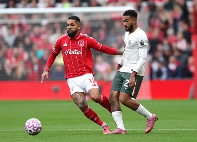 Douglas Luiz of Nottingham Forest controls the ball whilst under pressure from Reece James