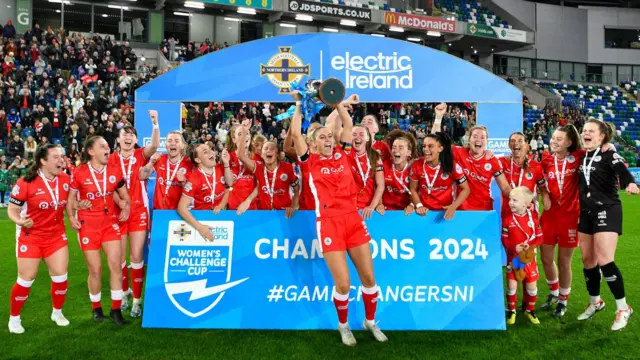 Kelsie Burrows lifting the trophy 12 months ago