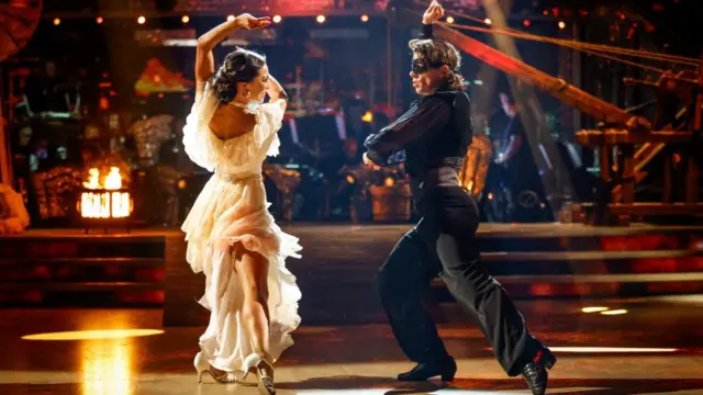 Lewis Cope and Katya Jones dressed in flamenco costuming.