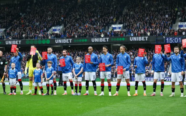 Rangers players line up at Ibrox
