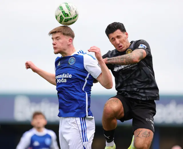 Players battling for the ball during Carrick vs Glenavon