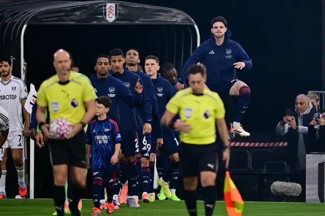 Declan Rice (R) and teammates come out of the tunnel
