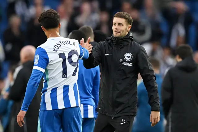 Fabian Hurzeler, Manager of Brighton & Hove Albion, shakes hands with Charalampos Kostoulas