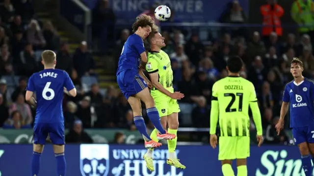 Wout Faes and Colby Bishop clash heads