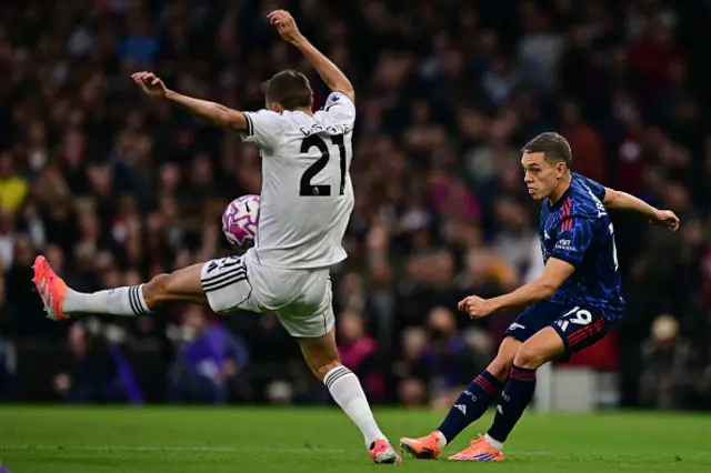 Leandro Trossard (R) vies with Fulham's Belgian defender #21 Timothy Castagne