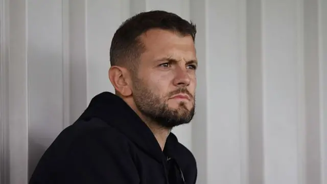 Jack Wilshere watching a game