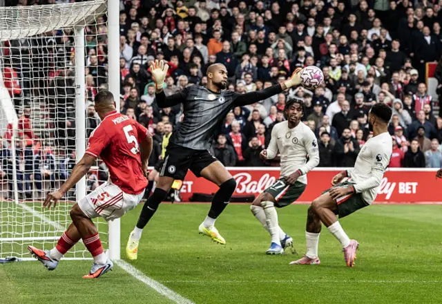 Nottingham Forest's Murillo (left) looks on as Chelsea's goalkeeper Robert Sanchez saves his effort