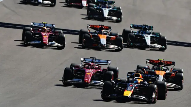 Verstappen being chased by Leclerc and Norris