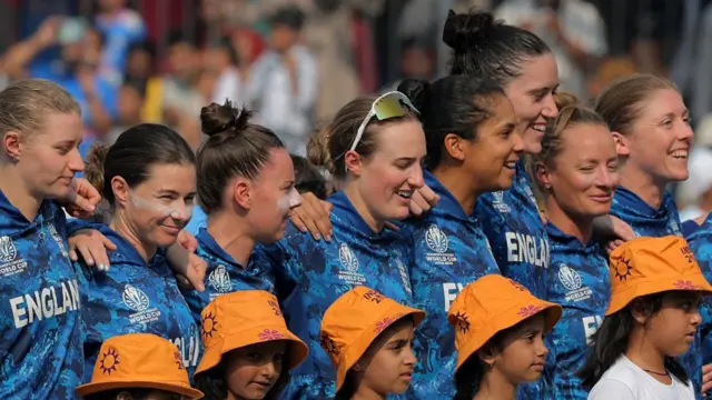 Players of England line up for the national anthems prior to the ICC Women's Cricket World Cup India 2025 match