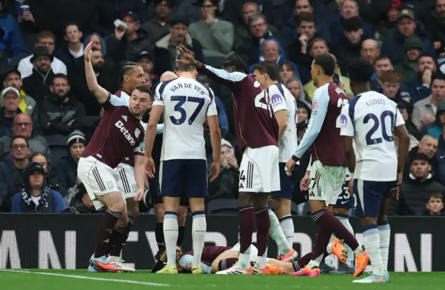 Aston Villa's Lucas Digne reacts after sustaining an injury