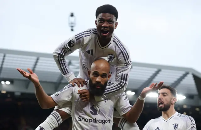 Bryan Mbeumo celebrates scoring with Amad Diallo on his shoulders