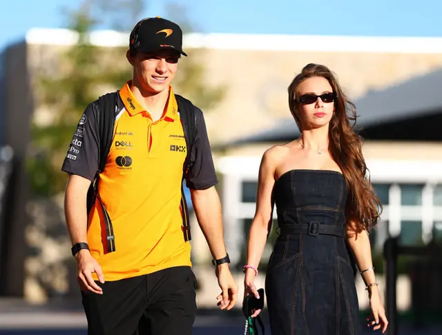 Oscar Piastri and his girlfriend Lilly arrive in the paddock