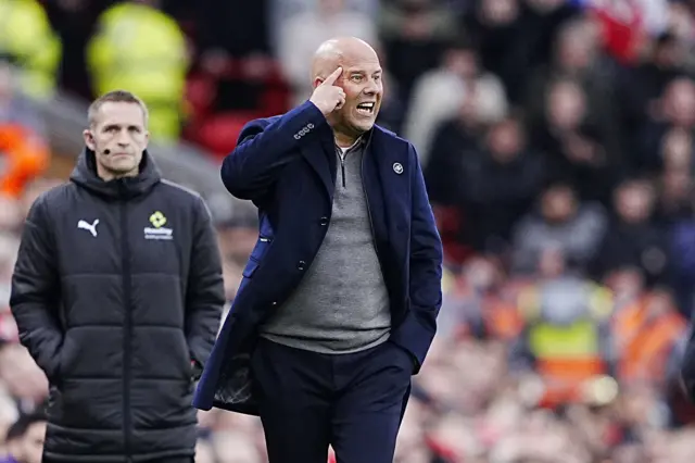 Slot points to his head to indicate to his players to think