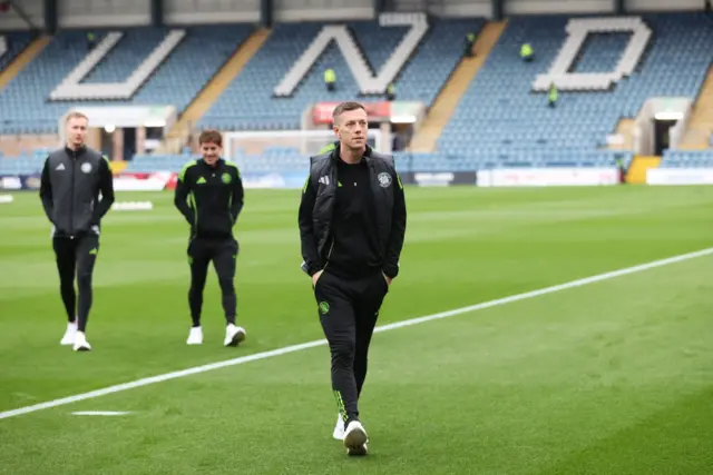Celtic skipper Callum McGregor strolling across the Dens Park turf