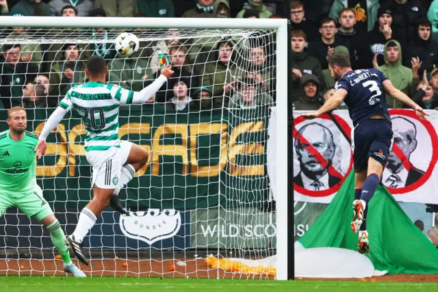 Clark Robertson heads Dundee in front