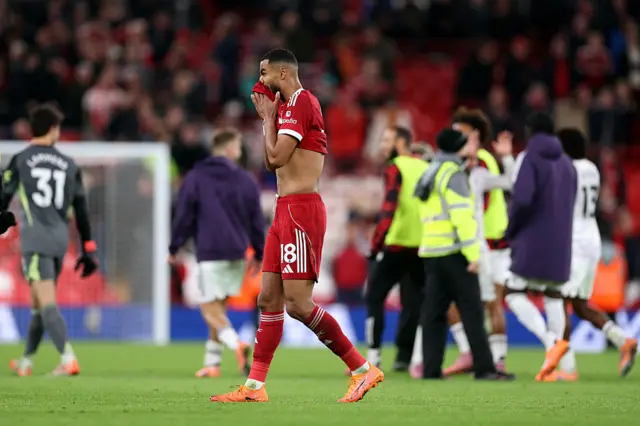 Gakpo covers his shirt with his face at full time