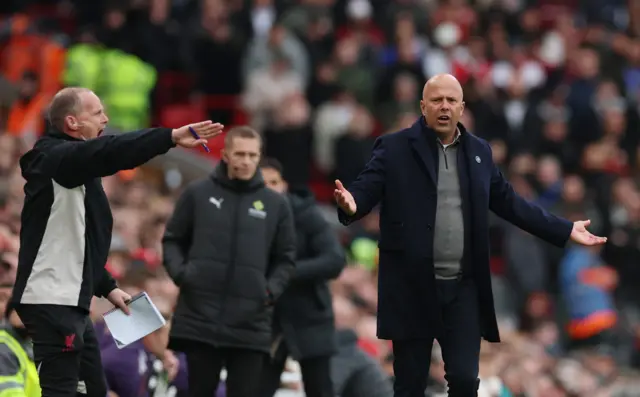 Slot appeals arms wide to the fourth official for a penalty