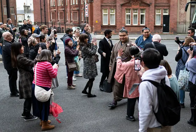 Takayasu arrives off the bus