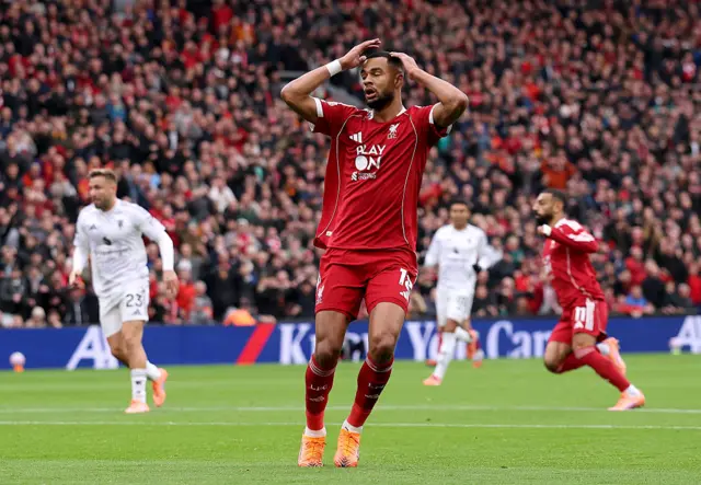 Gakpo reacts to his shot hitting the post