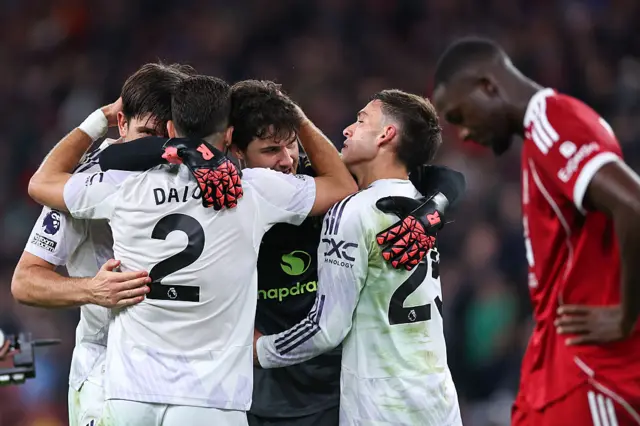 United's defence and keeper celebrate at the full time whistle